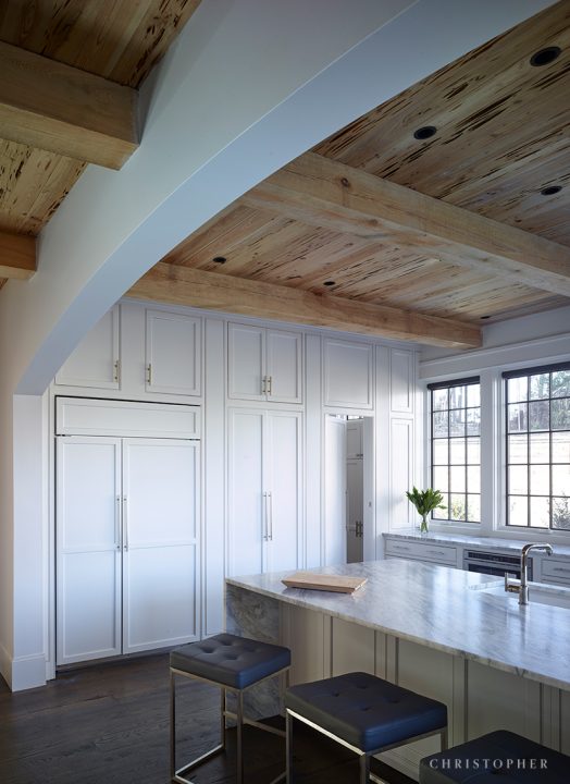 White French Estate Kitchen with Custom Cabinetry and Hidden Pantry