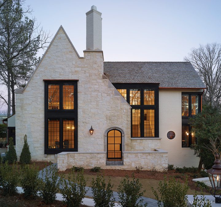 Light Filled French Estate Front Exterior with Two Story Windows