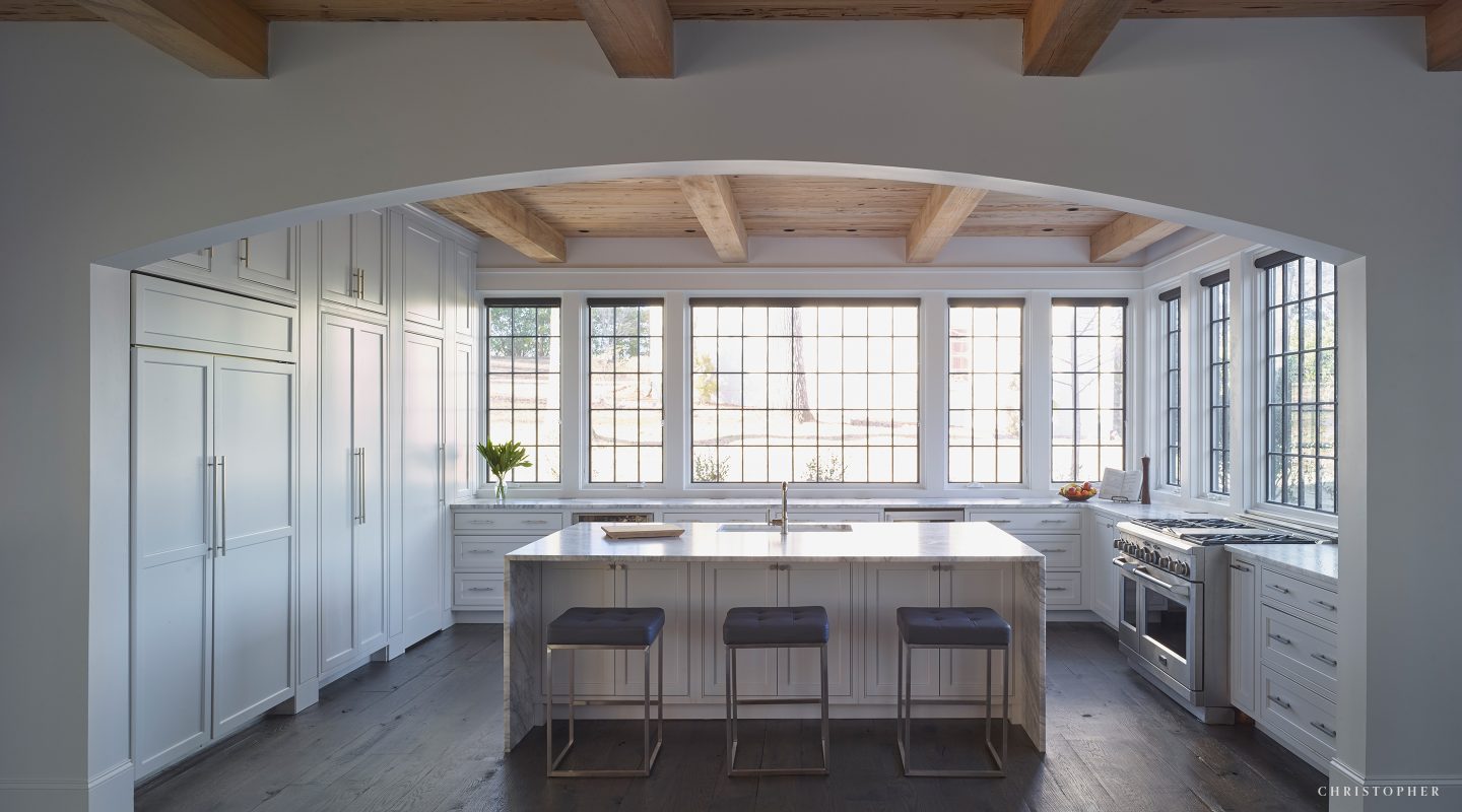 White French Estate Kitchen with Island and Wall to Wall Windows