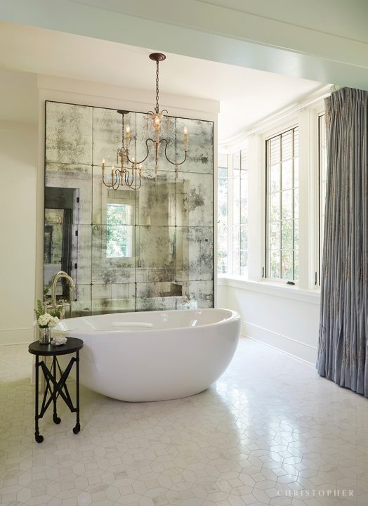 French Normandy Master Bathroom with Free Standing Tub and Antiqued Mirror Wall