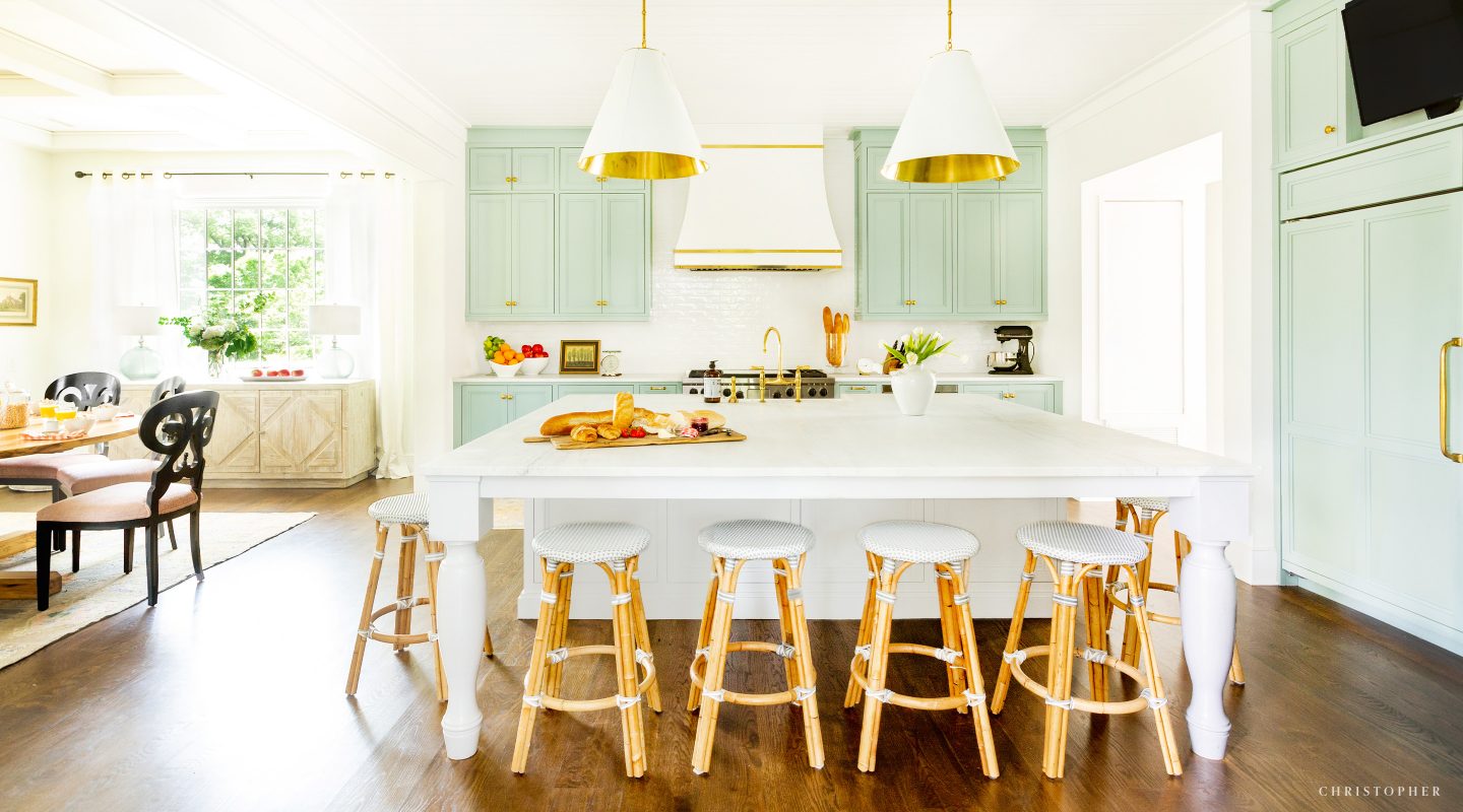 Christopher Architecture and Interiors Kitchen with Colorful Cabinetry, 10 foot island, and oversized pendant lighting